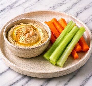 Celery & carrot sticks with creamy hummus